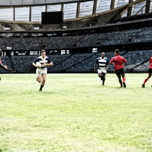 Digital composite image of team of rugby players playing rugby in sports stadium
