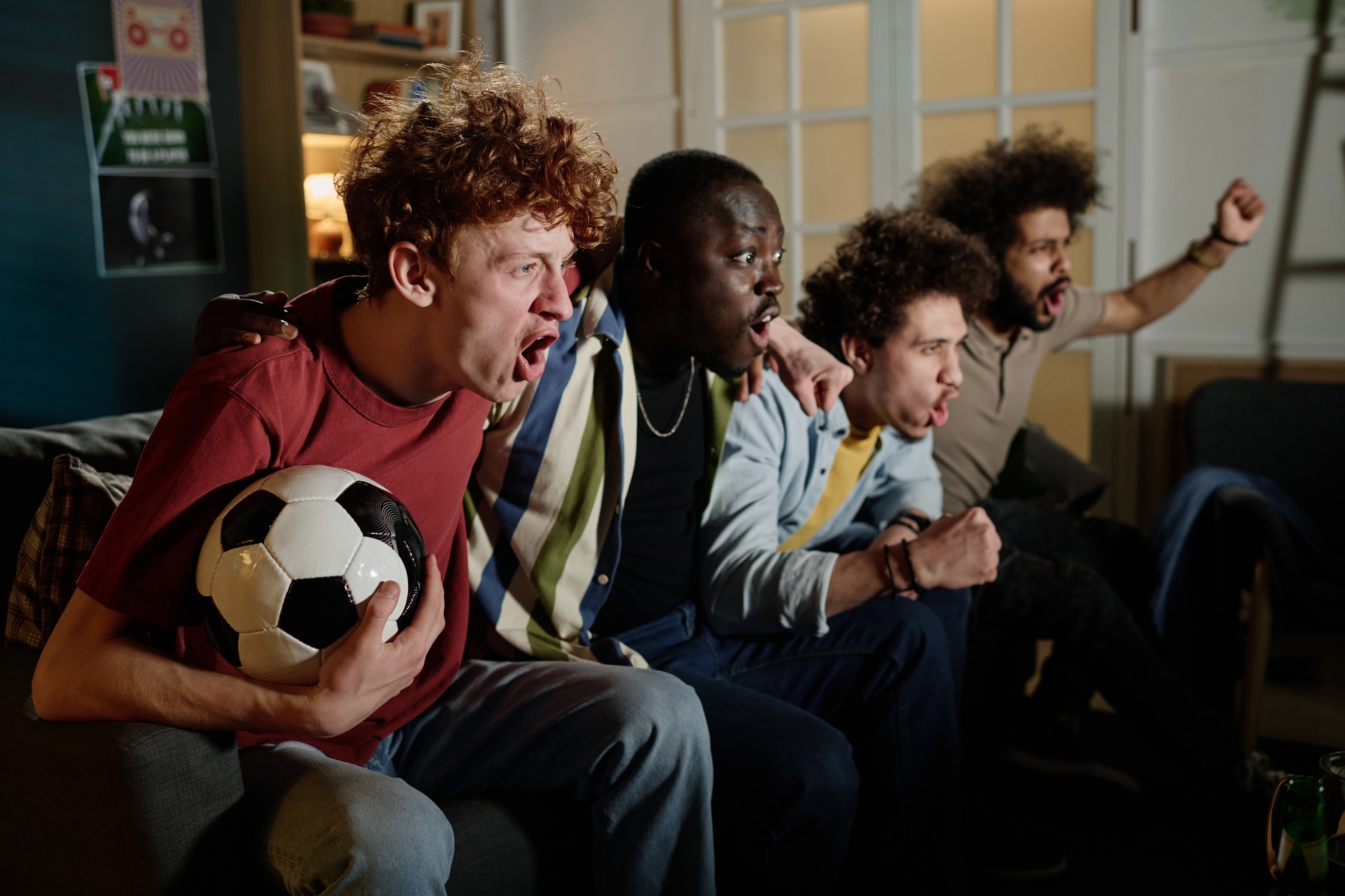 Soccer Fans Watching Match In Evening